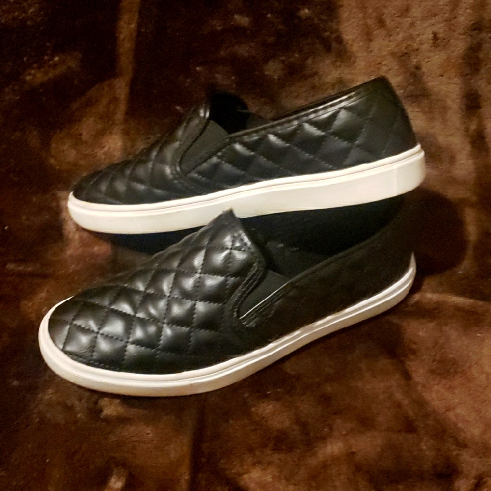 Black leather quilted slip ons